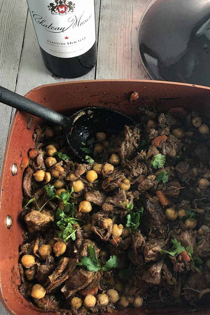 beef and lamb tagine in a copper pot.
