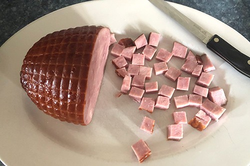 cutting ham for pasta dish.