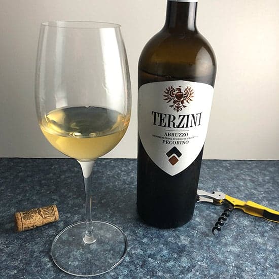 bottle and glass of Terzini Pecorino white wine.