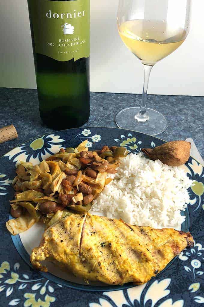 South African Chicken plated with chakalada and served with Chenin Blanc white wine.