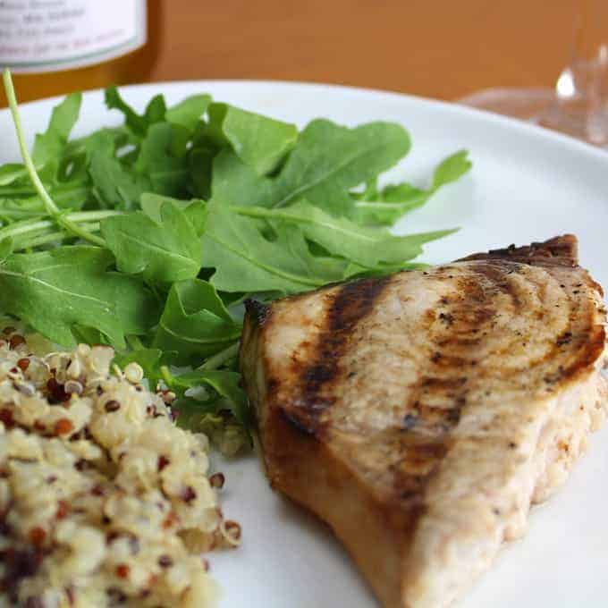 grilled swordfish with garlic soy marinade on a plate.