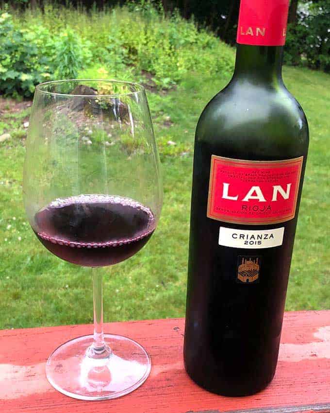 bottle of LAN Crianza Rioja with a glass next to the bottle.