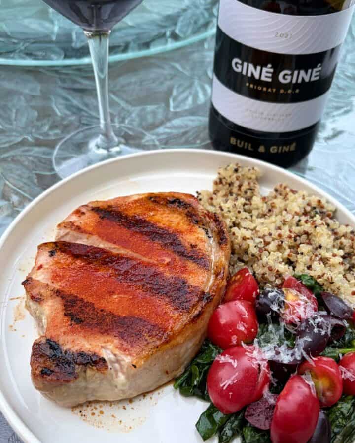 Grilled pork chops on a plate.