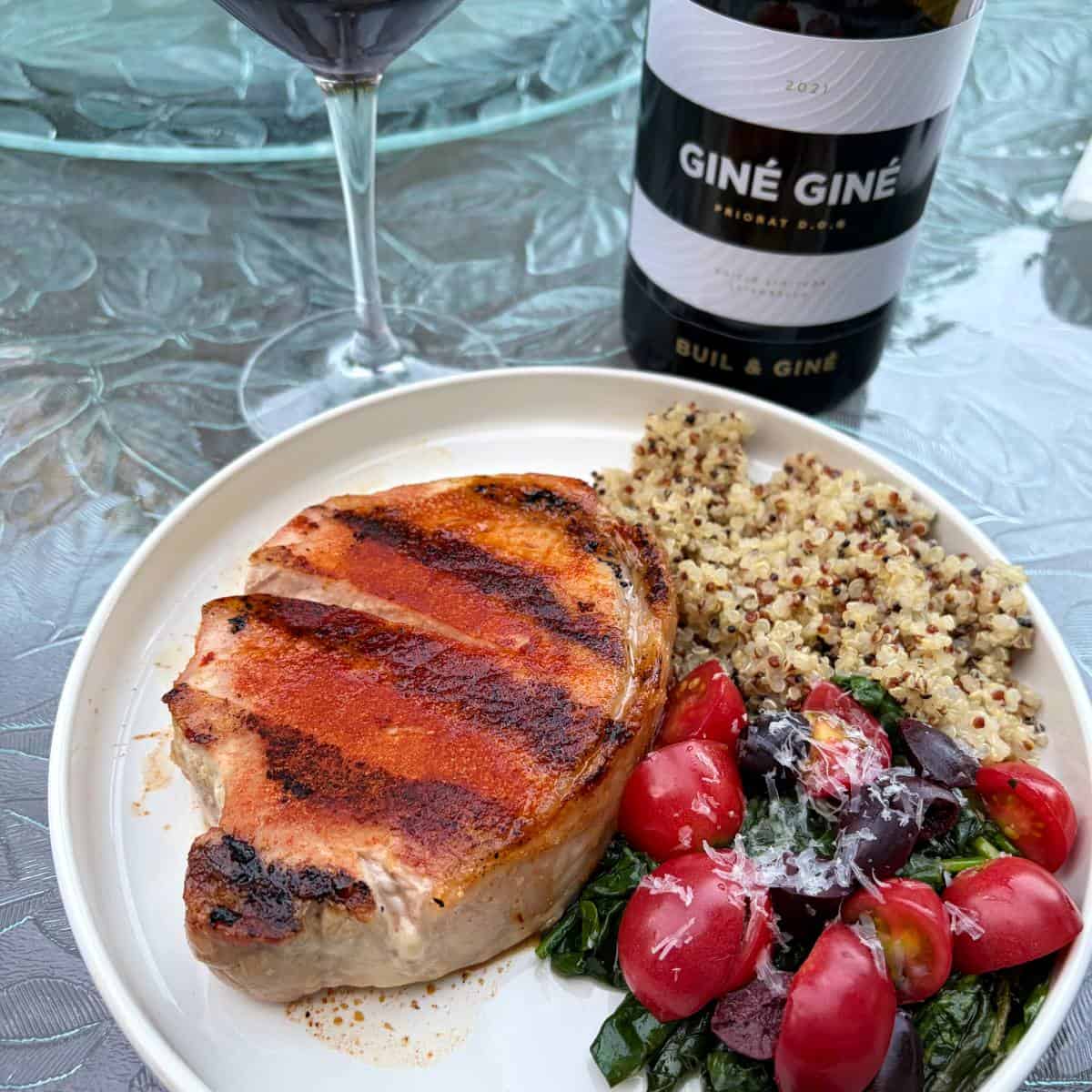 Grilled pork chops on a plate.