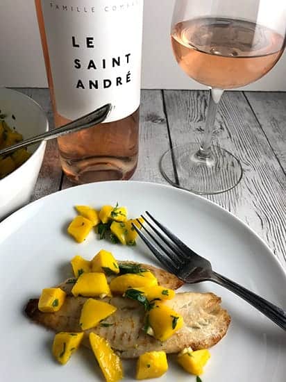 tilapia with mango salsa served with rosé wine.