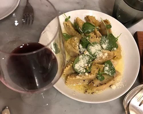 agnolotti plated at SRV with red wine.
