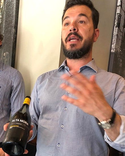 presenting an Etna Bianco wine.