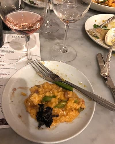 Lobster risotto paired with a rosé wine.