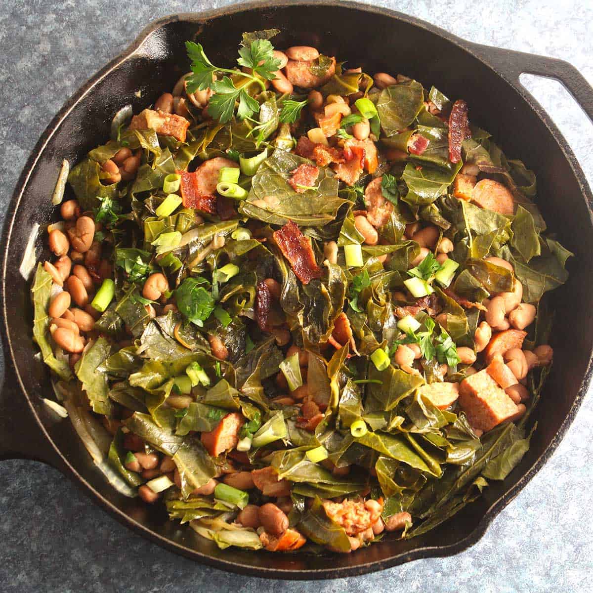 Brazilian beans and greens in a skillet.