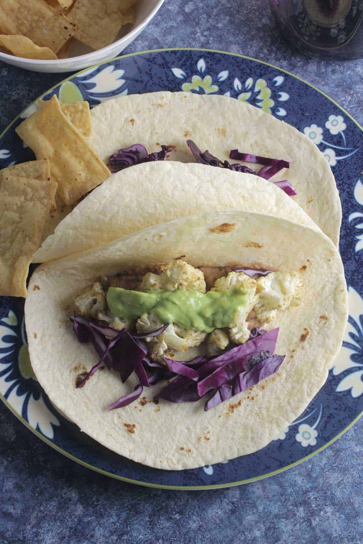 roasted cauliflower tacos on a plate.