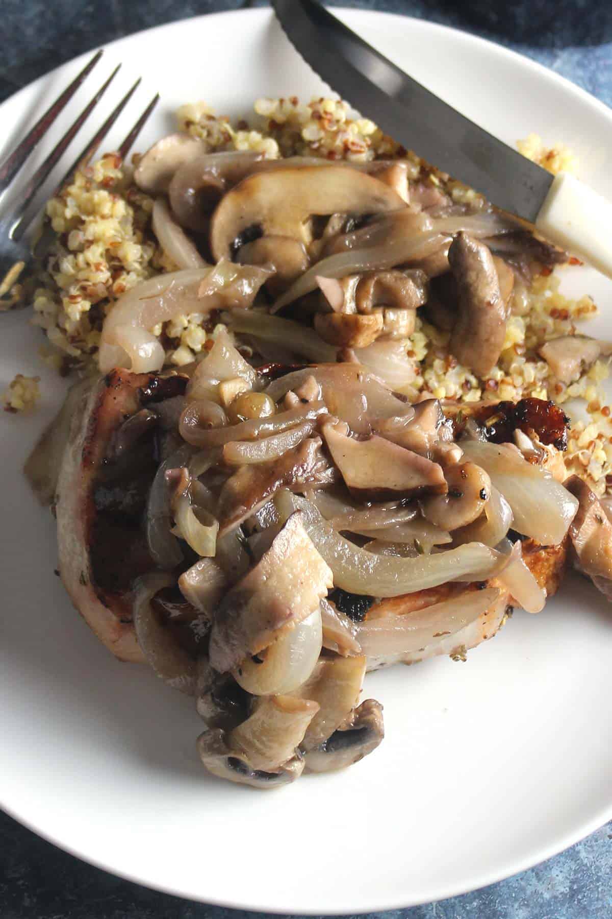 pork chops topped with garlic mushroom sauce.