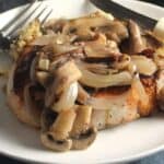 pork chops plated with mushroom sauce