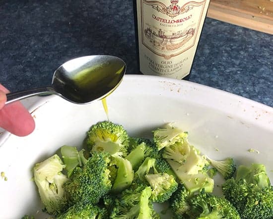 drizzling extra virgin olive oil over broccoli prior to roasting.