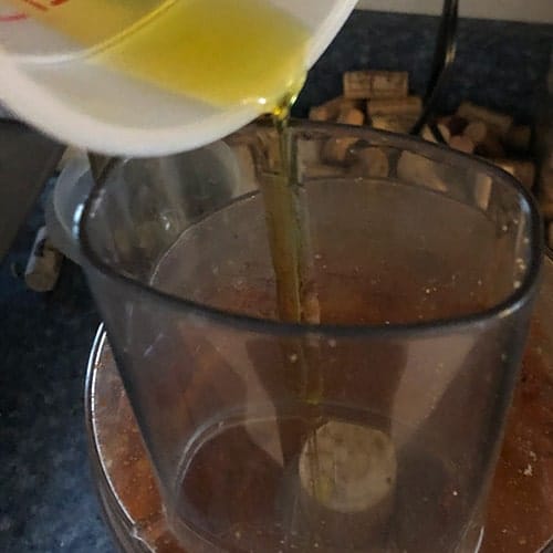 adding olive oil to muhammara