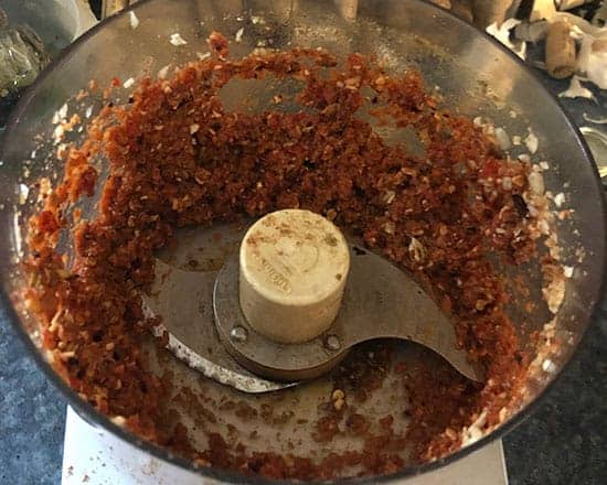 chopping muhammara ingredients in food processor