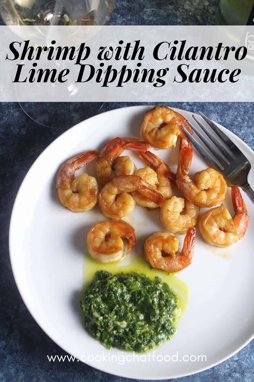 shrimp served with cilantro lime sauce on a white plate