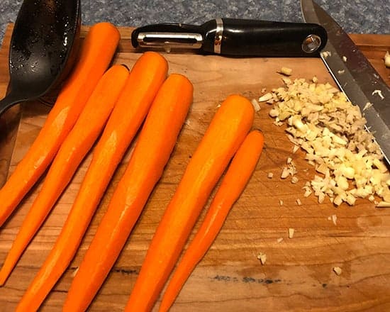 carrot and ginger on a cutting board.