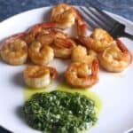 shrimp plated with cilantro dipping sauce.