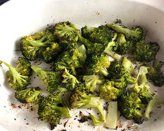 roasted broccoli in baking dish.