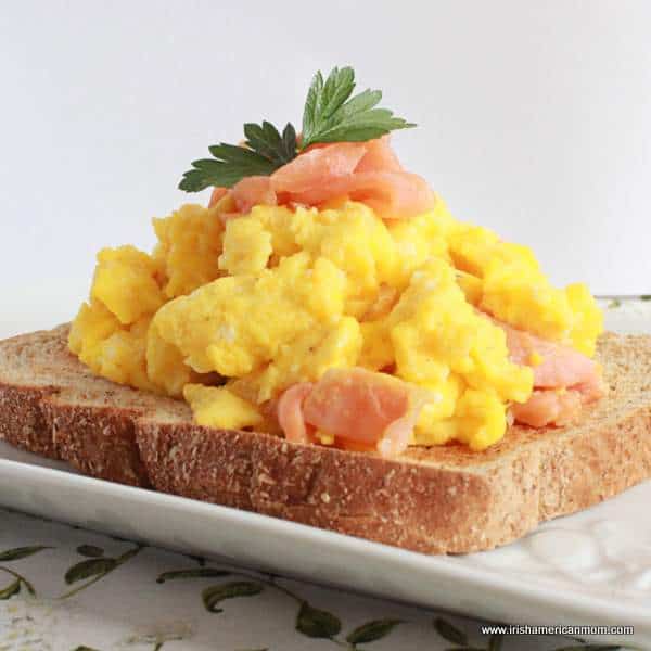 scrambled eggs and smokes salmon served on toast.
