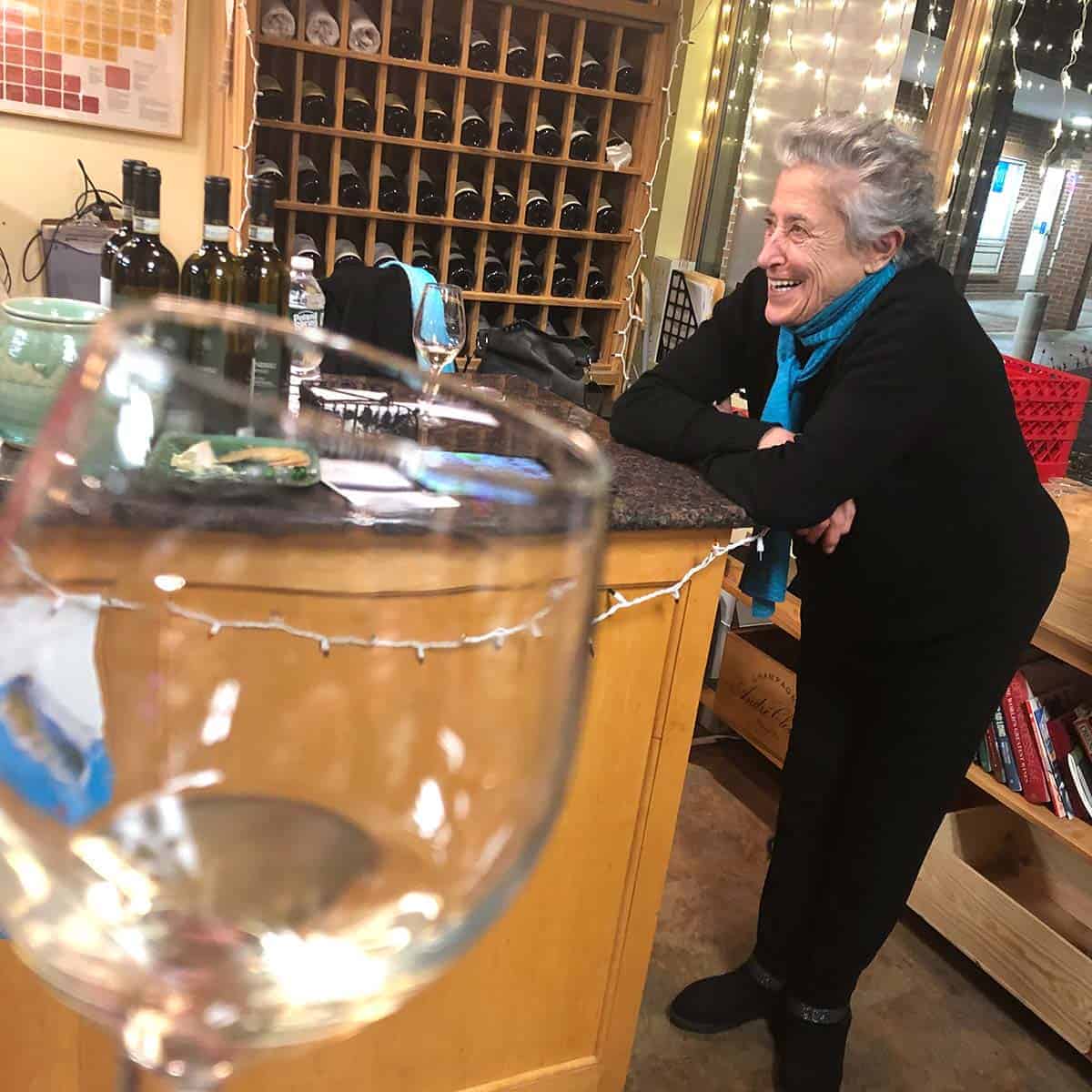 Italian winemaker visiting local wine shop