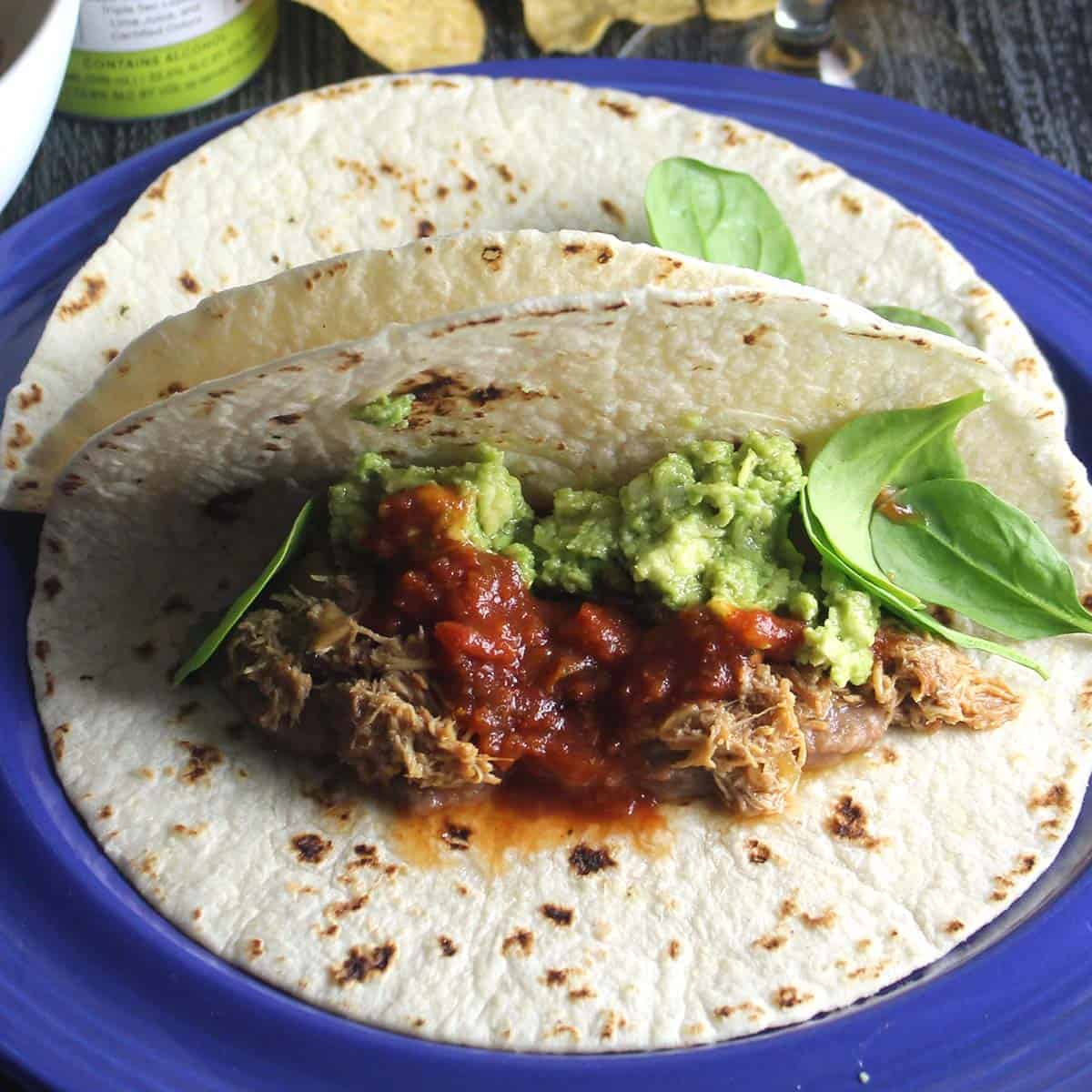 pulled chicken tacos on a plate