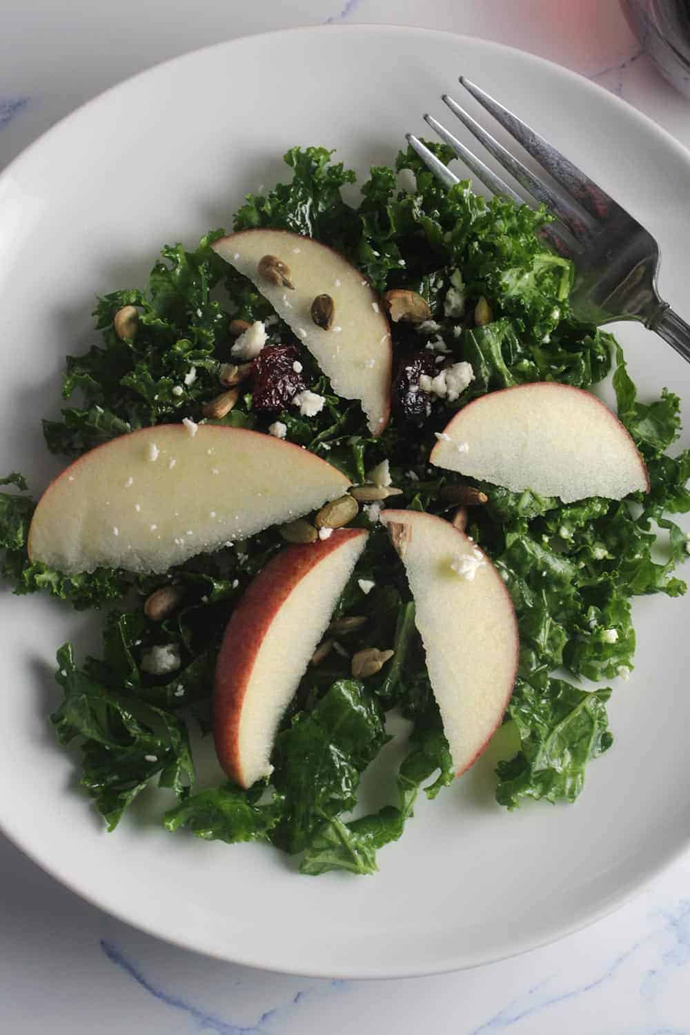 kale and apple salad plated.