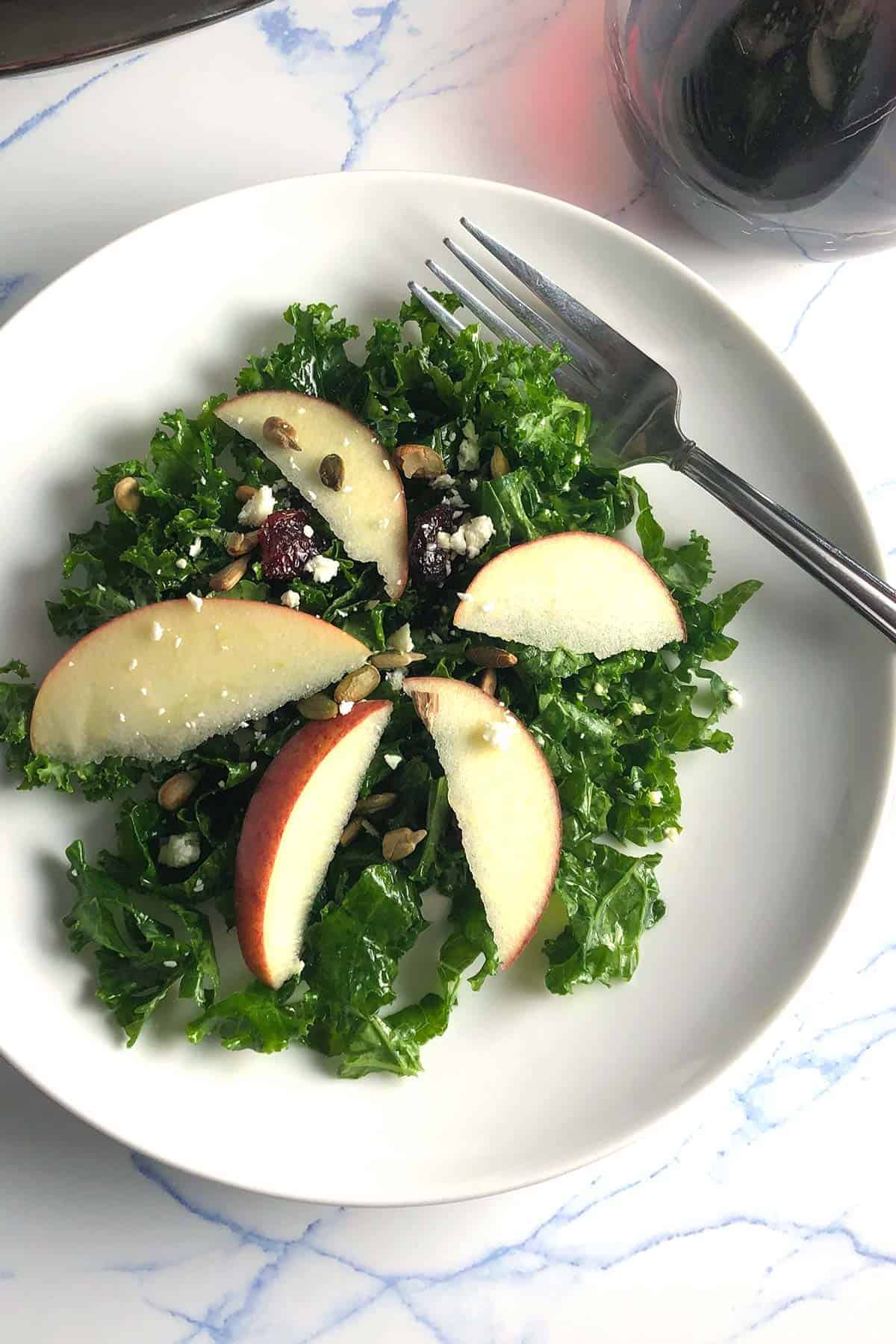 plate with kale and apple salad