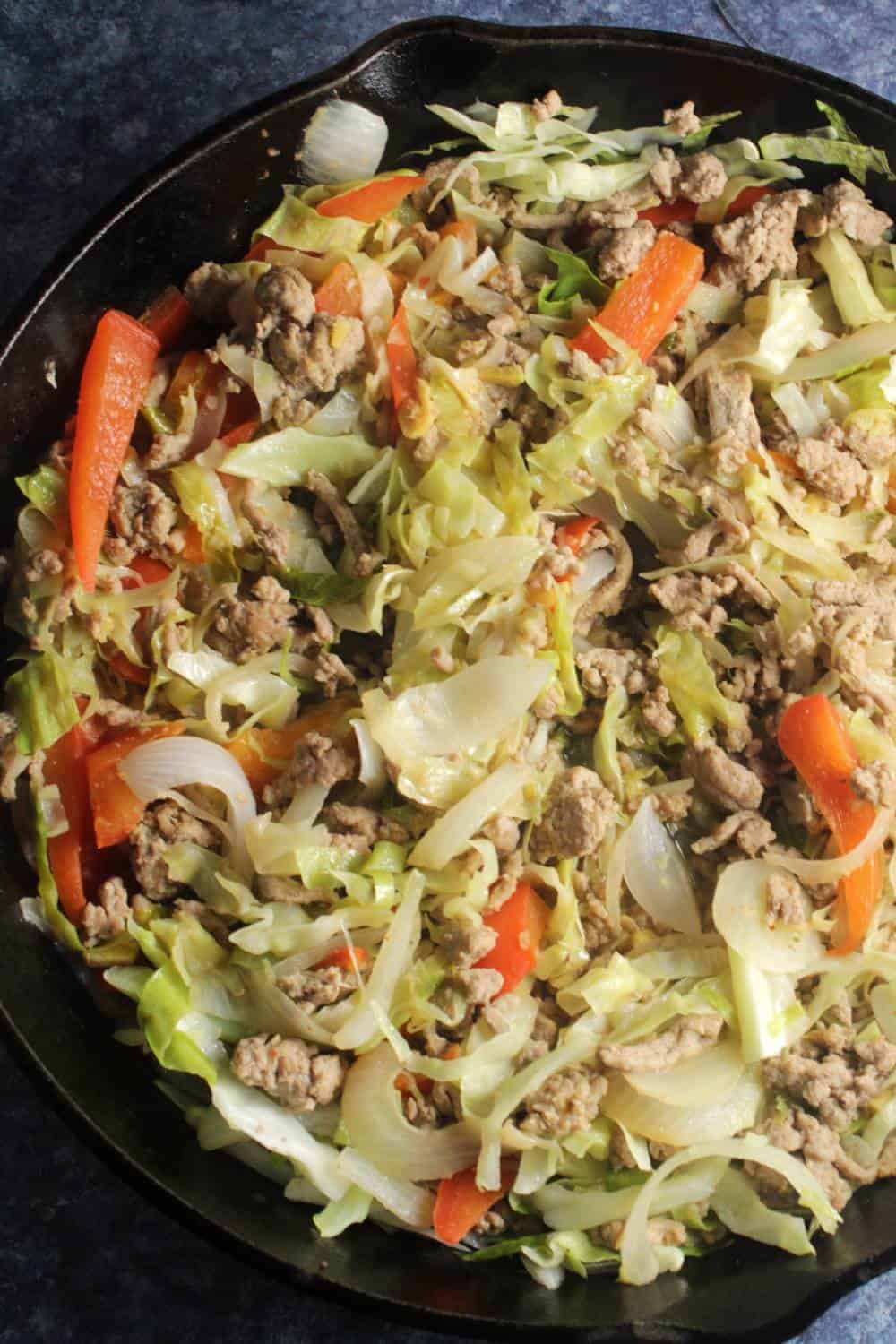 skillet with cabbage cooked with ground turkey