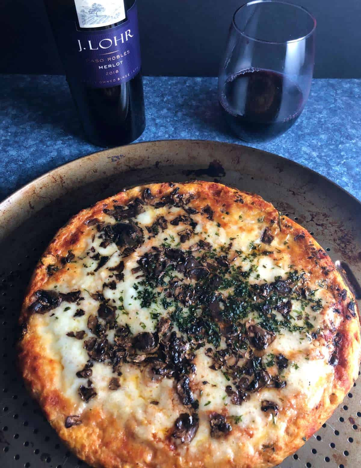 mushroom pizza served with Merlot.