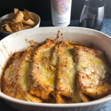 beef and bean enchiladas in a baking dish.