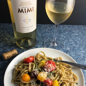 White moldovan wine served with pesto pasta