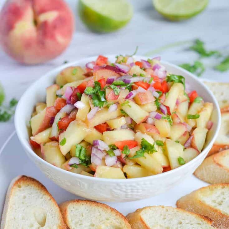 peach salsa in a white bowl