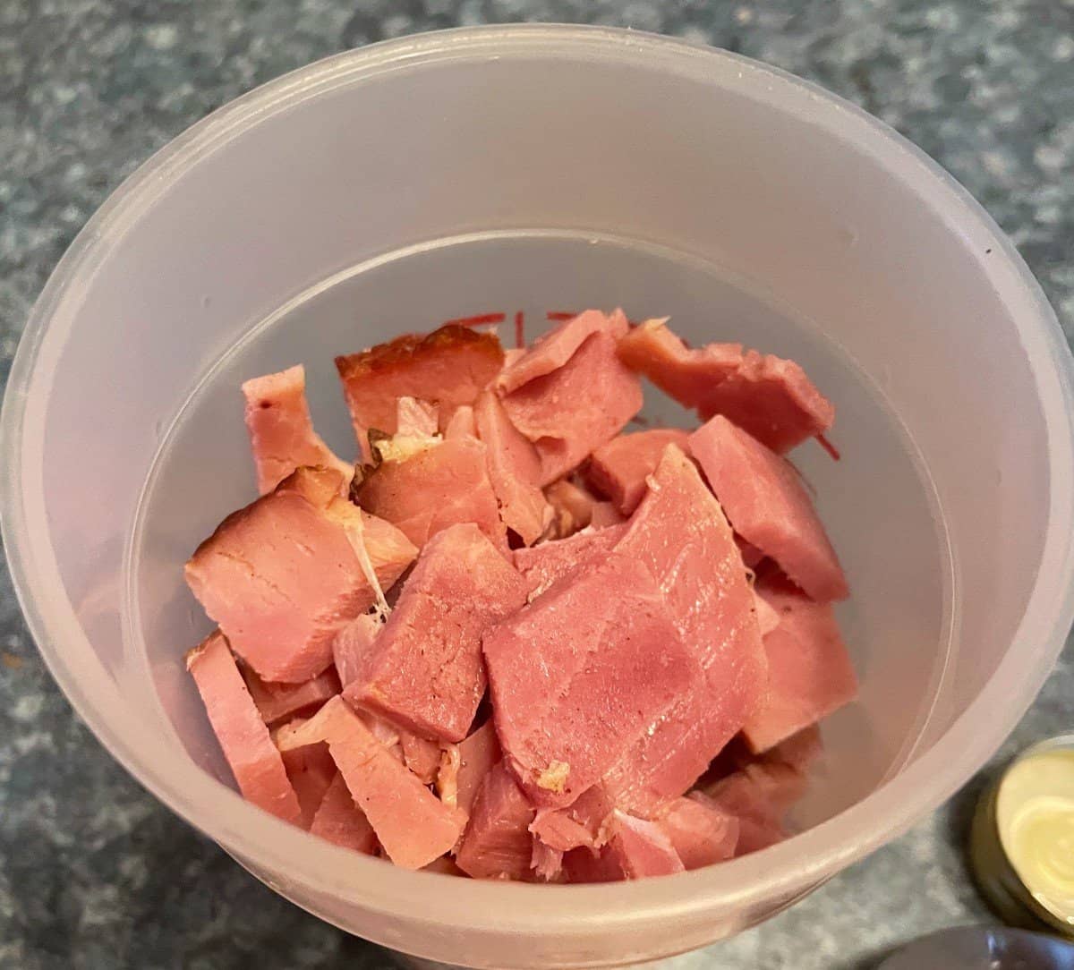 leftover ham in a measuring cup, cut into bite sized pieces.