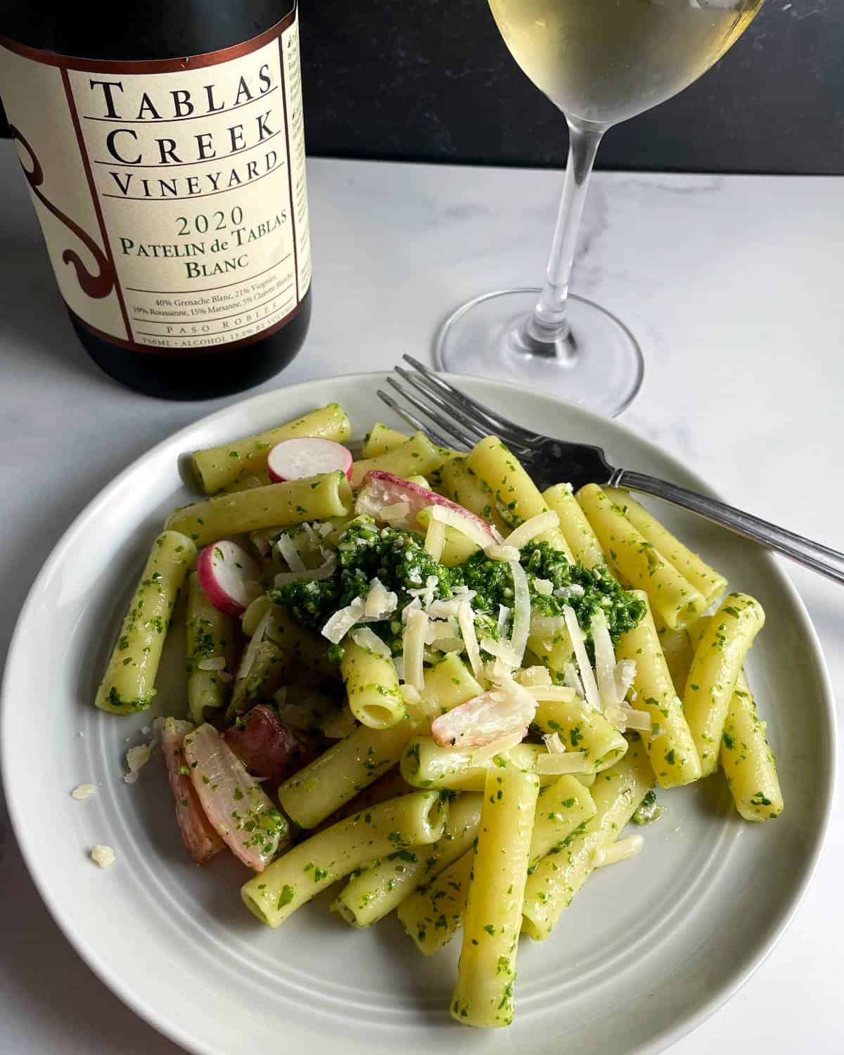 Ziti pasta tossed with radish green pesto and roasted radishes. Served with a white wine. 