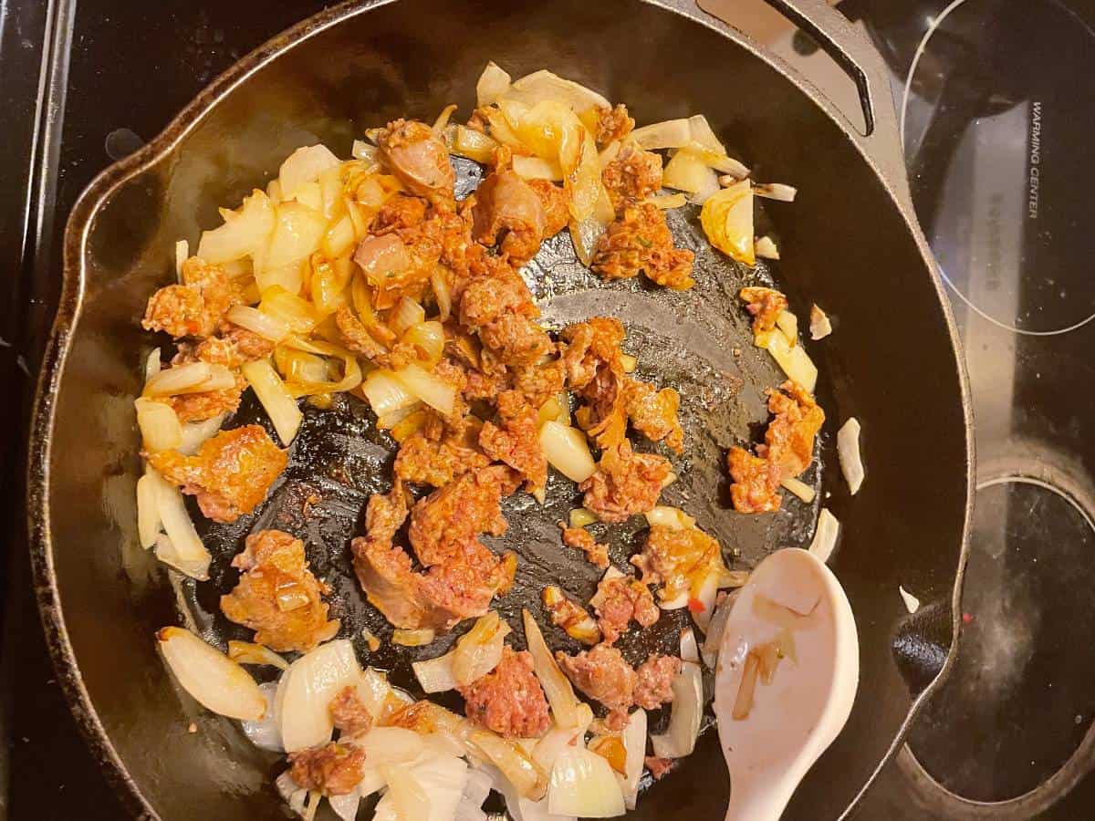 Add sausage pieces to skillet.