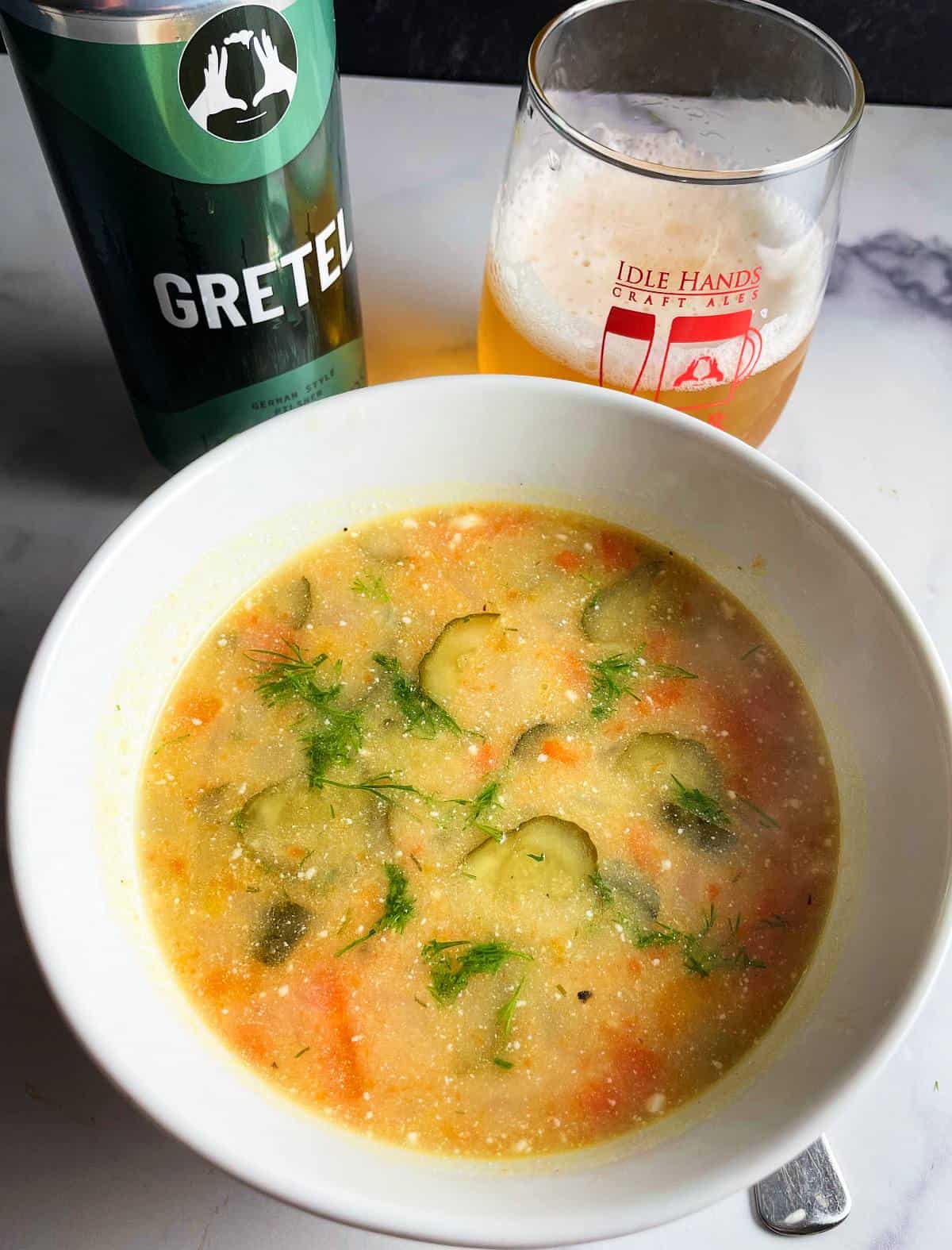 Polish dill pickle soup served along with a glass of Idle Hands Gretel beer.