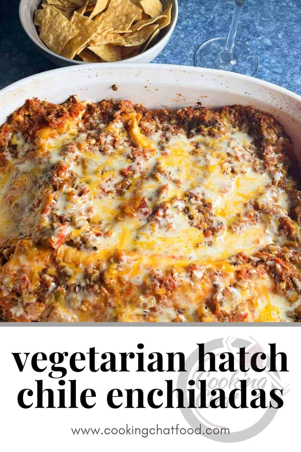 Hatch chile enhiladas in a baking dish, with melted cheese and sauce on top. Text underneath the food says "vegetarian hatch chile enchiladas".
