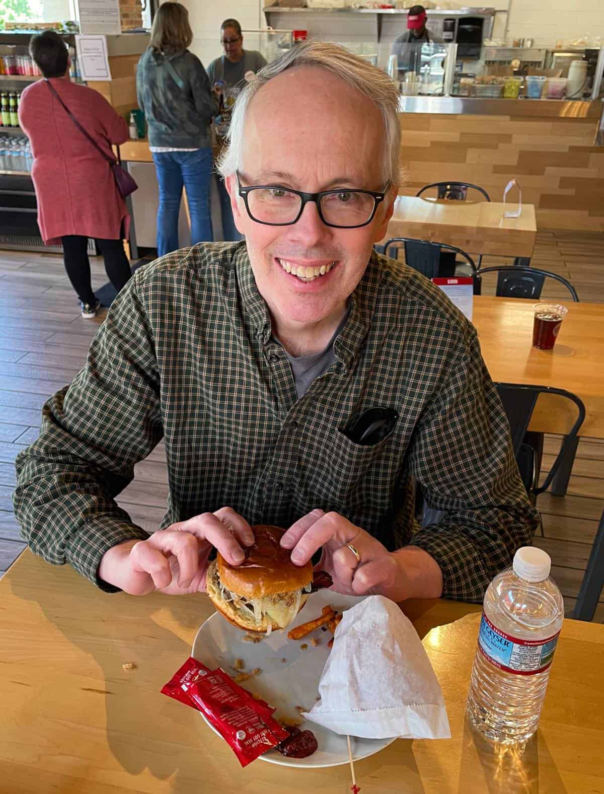 David Crowley, author of Cooking Chat, enjoying a local grass-fed burger at B. Good in Woburn.