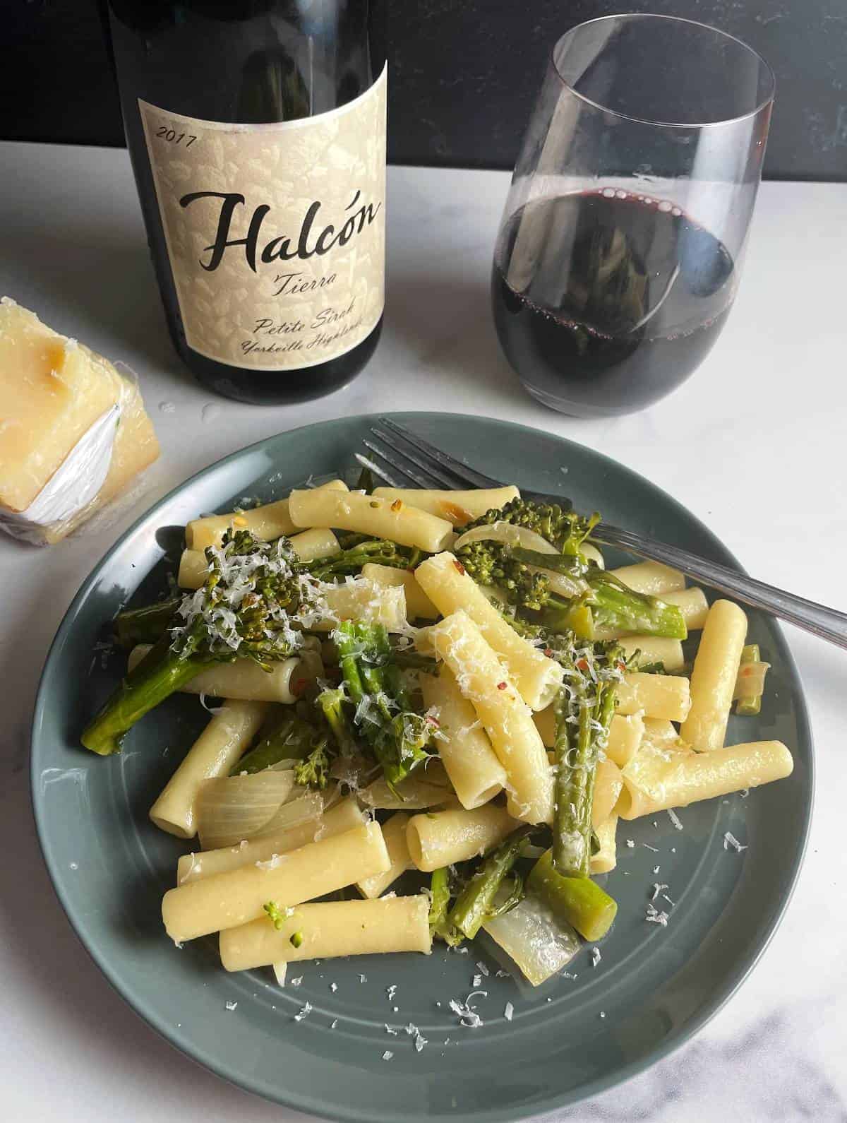 plate of broccolini pasta paired with a red Petite Sirah wine.