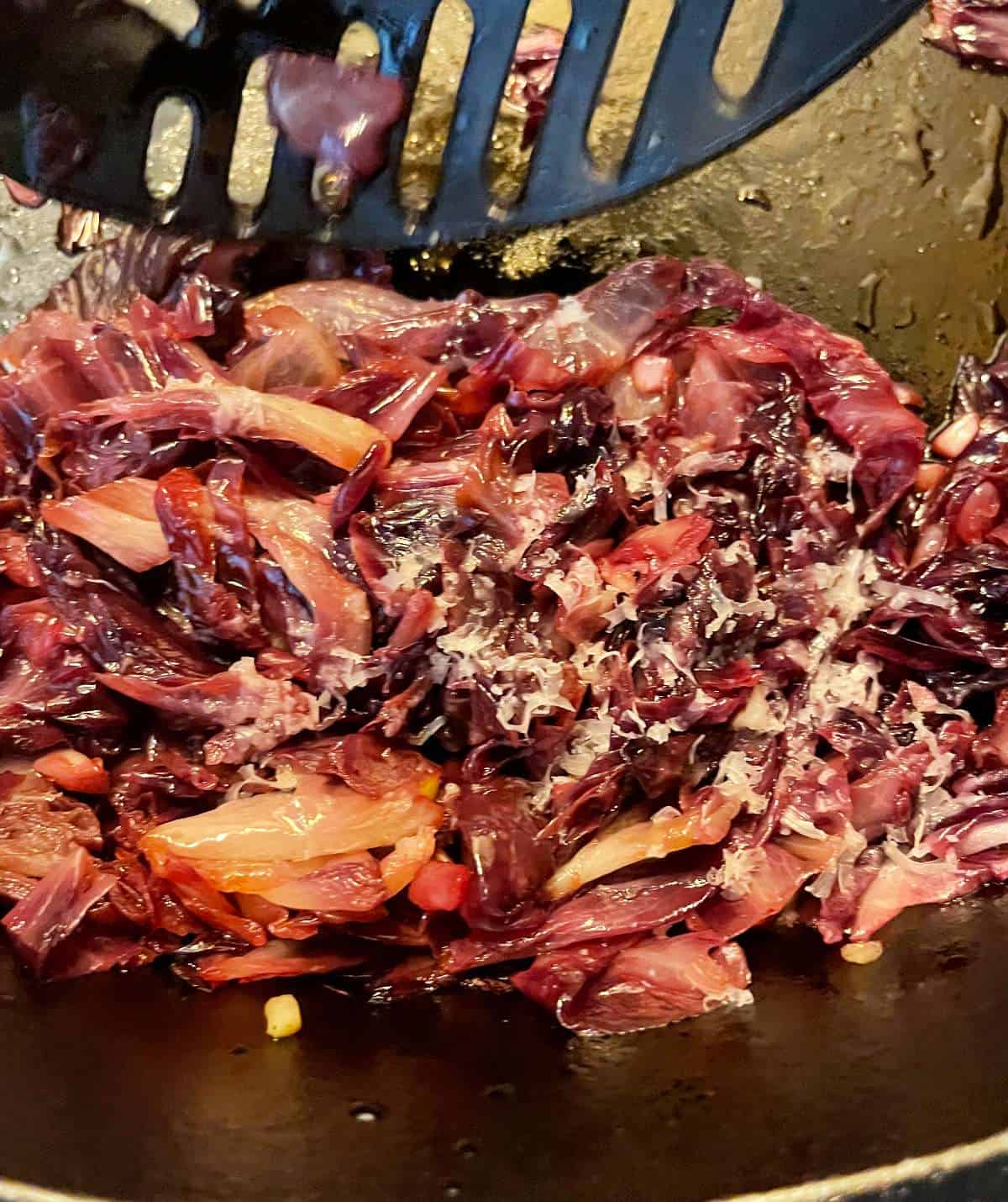 stirring cheese and balsamic vinegar in with sautéed radicchio.