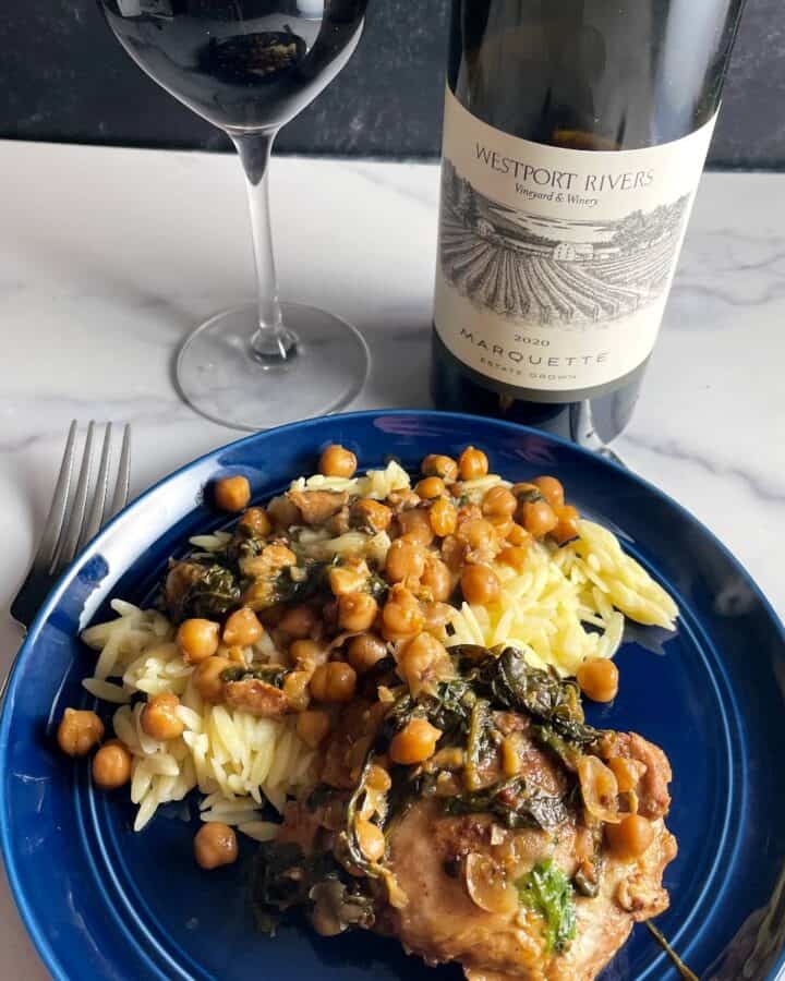 plate of Moroccan chicken served with red Marquette wine.