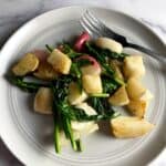 roasted hakurei turnips on a gray plate.