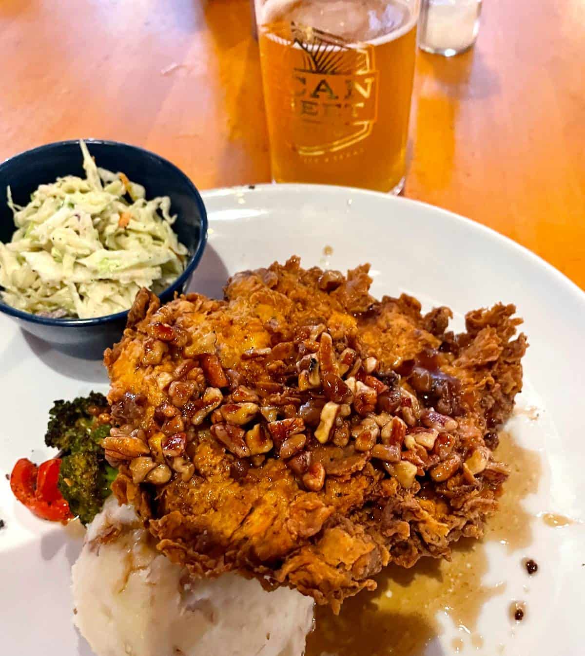 fried chicken served with cole slaw and a beer.