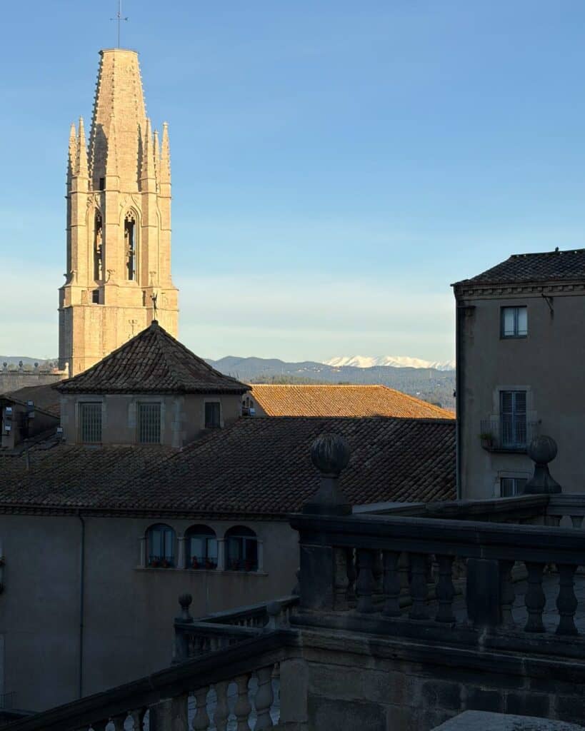 Cathedral in the foreground with snow capped mountains in the distance. Taken in Girona, Spain.