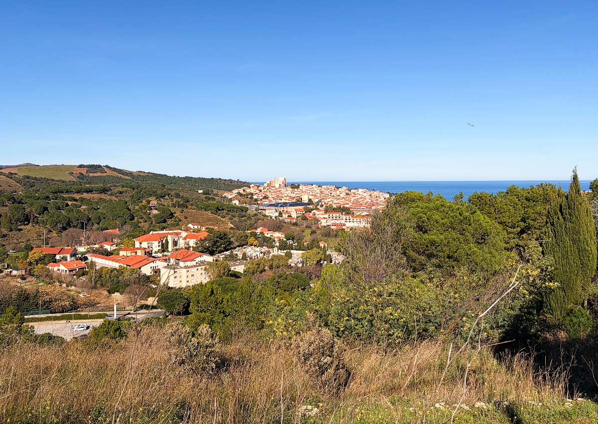 a distant view of Banyuls sur Mer and the sea beyond it.