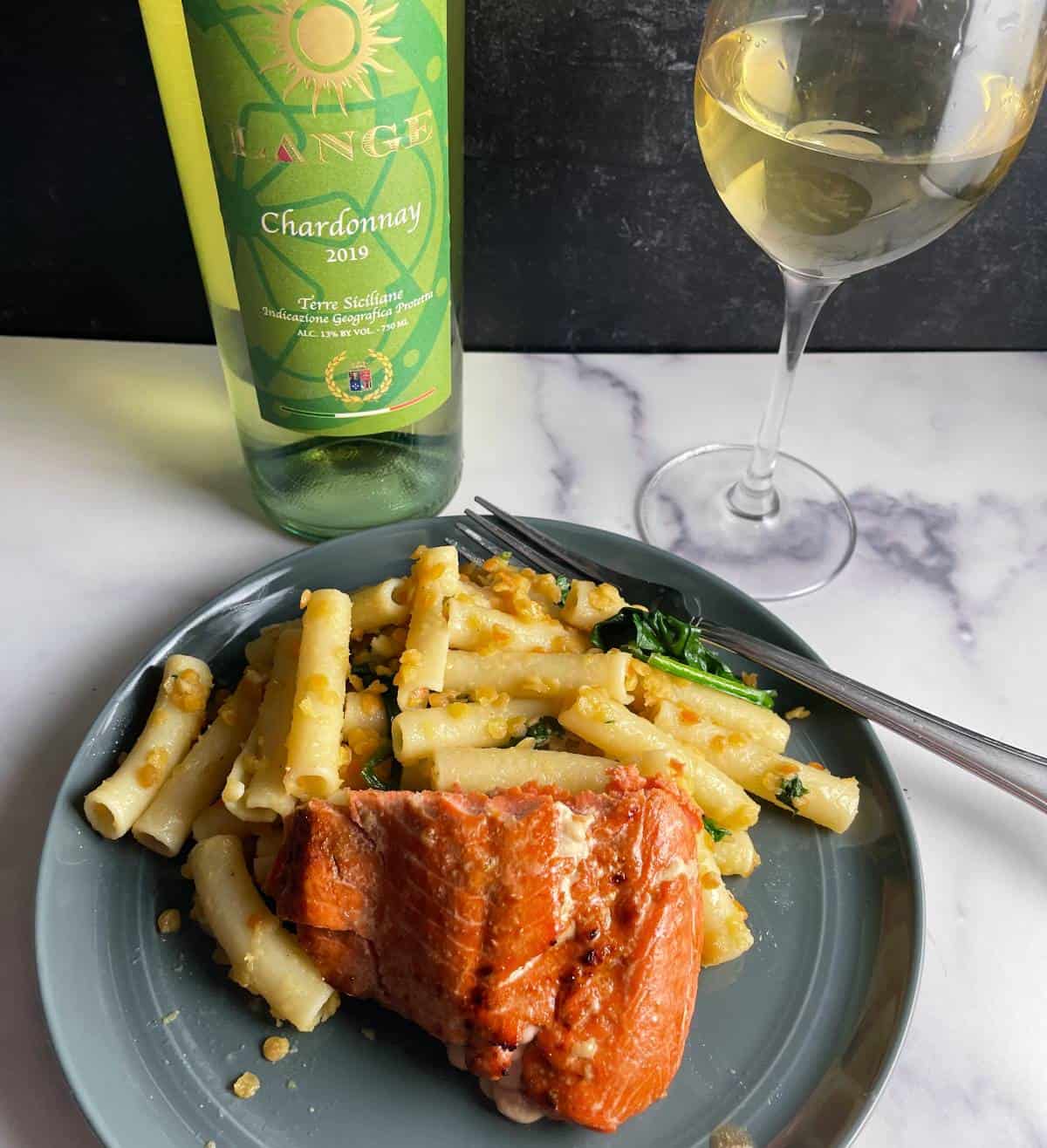 salmon plated with penne pasta and red lentils, served with a Chardonnay.