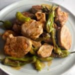 Spanish pork and peppers on a plate.
